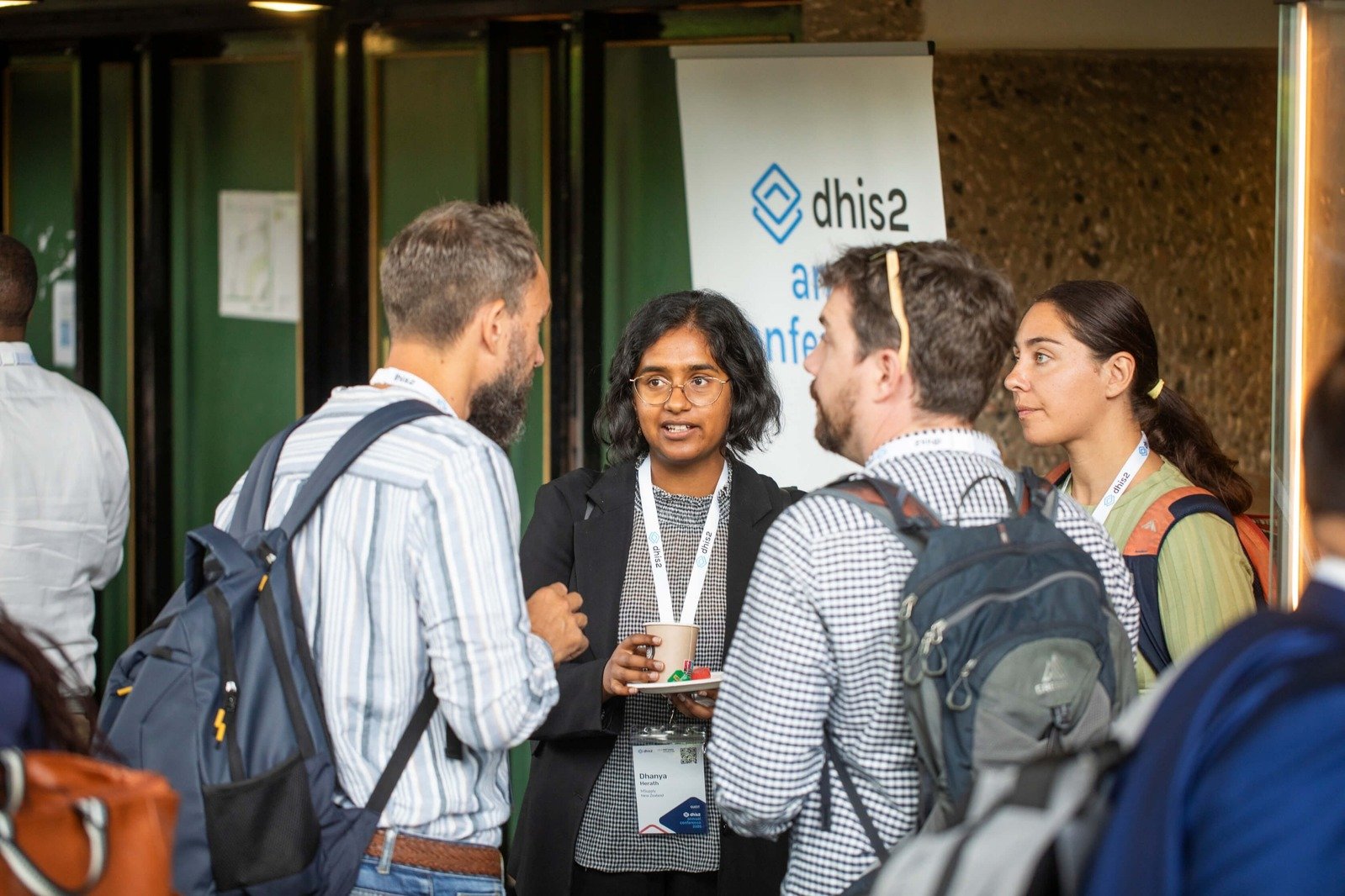 Attendees networking during a session break at the DHIS2 Annual Conference.